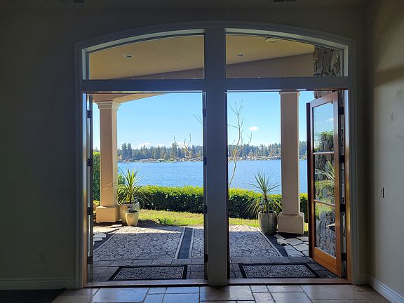French Doors opened leading to the coverd outdoor area