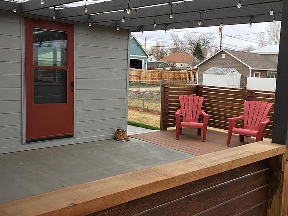 Large rear patio with pergola and cafe lighting. Plenty of