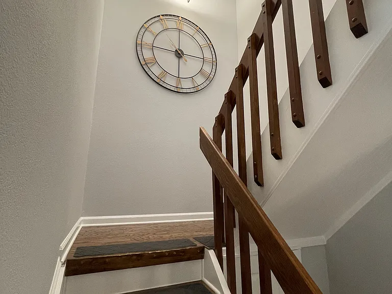 Stairway with chandelier and landing (looking up)