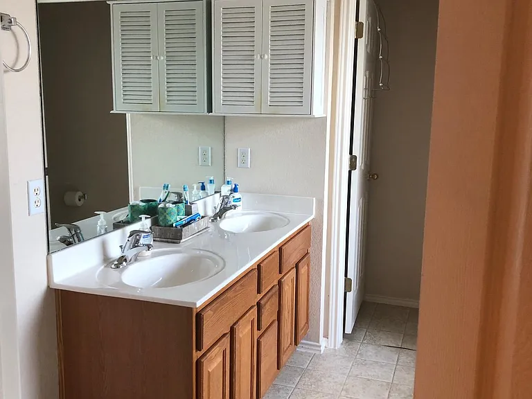 Flooring in the master bath and second full bath upstairs have been upgraded.