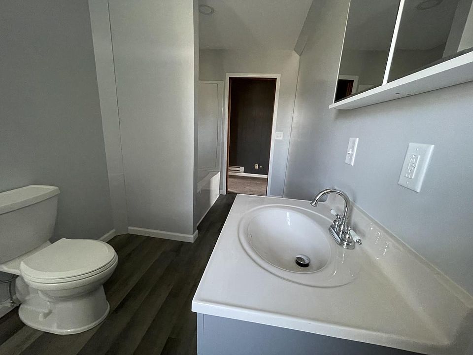 Updated bathroom with NEW flooring, sink/mirror, toilet, shower and washer/dryer