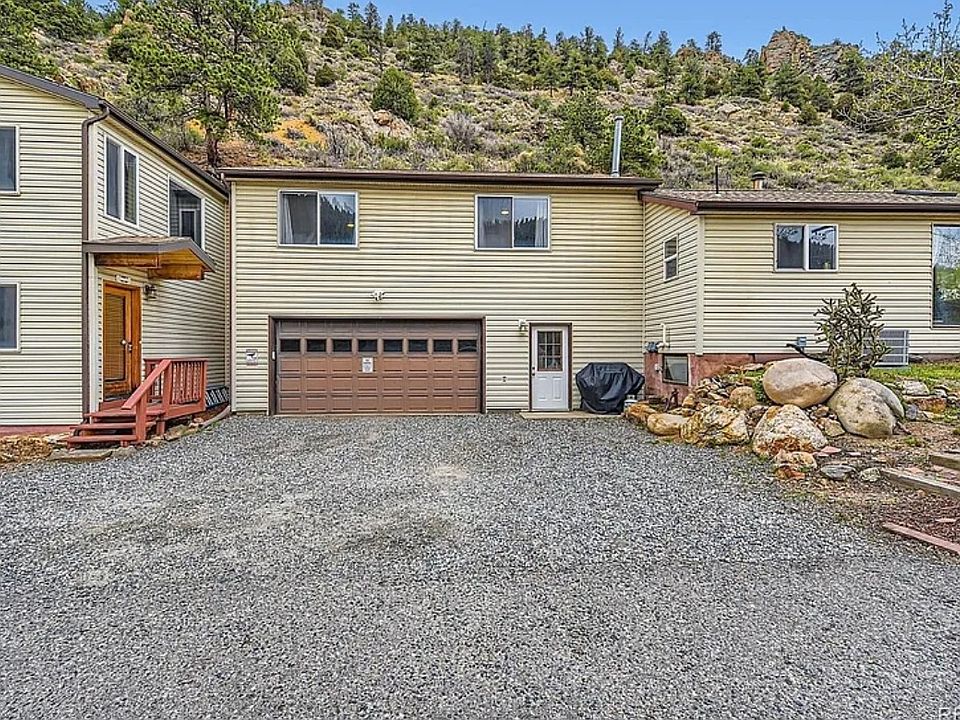 Front of house. There is also plenty of parking. The house also has laundry facilities in the garage in a laundry room. It has plenty of storage if needed. The house also has a whole house water treatment system. You can drink water right out of the tap.