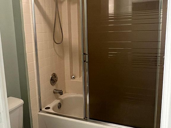 upstairs bathroom with tub, private section.