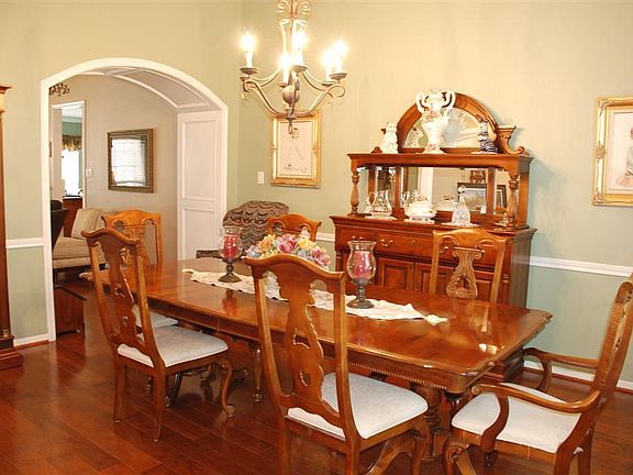 Formal dining room with archway in to Family Room.