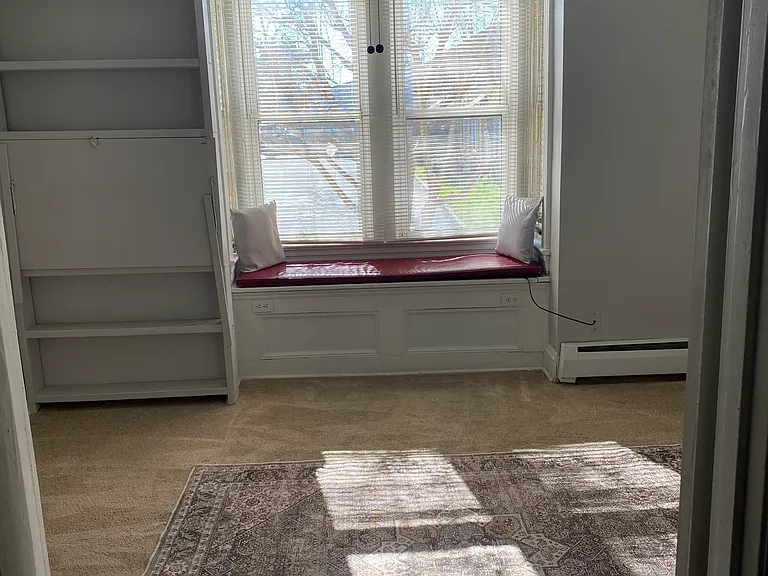 Bedroom has a window seat