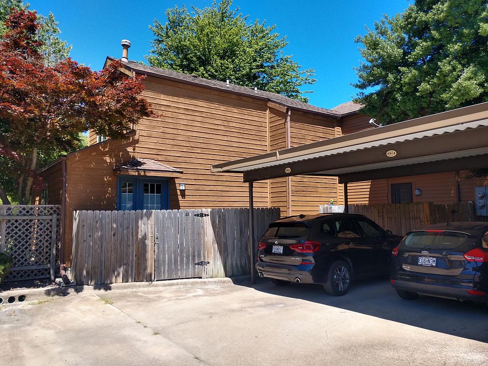 Fenced Rear Entry and Adjacent Two Parking Spaces.