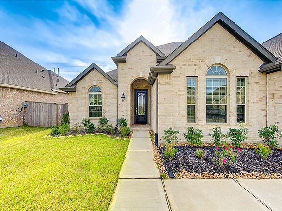 Inviting front door with keyless entry for your convenience and gutters where they are needed most.