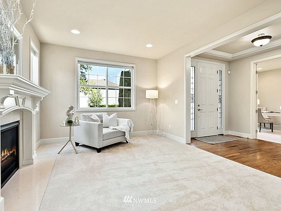 Living room with 1 of 2 cozy gas fireplaces.
