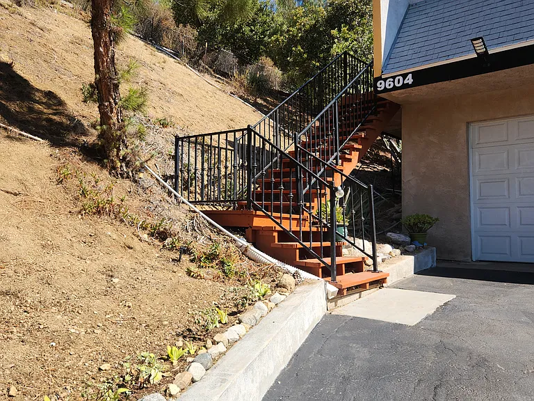 Front entrance, garden area, driveway, garage