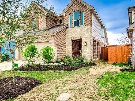 Welcome home! Charming landscaping lead you to the covered front porch and a beautiful front door.