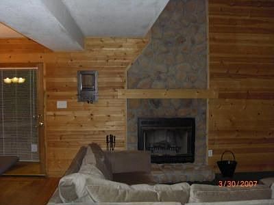 Wood Burning Fireplace with Stone Surround in Great Room.