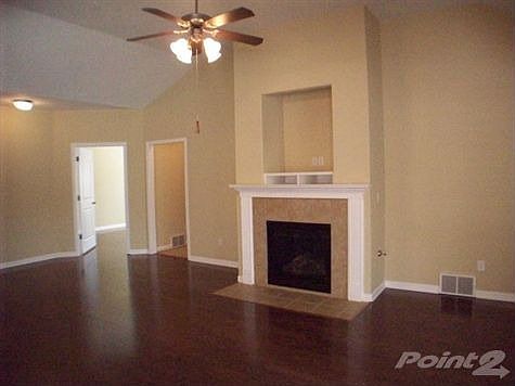 Beautiful hardwood floors,and soaring ceilings greet you in this spacious great room.