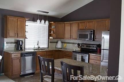 Breakfast bar, added cabinets, SS appliances and granite counters