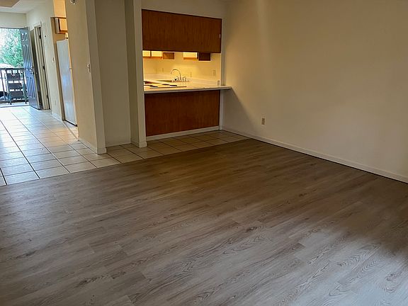 Living room area looking into the kitchen