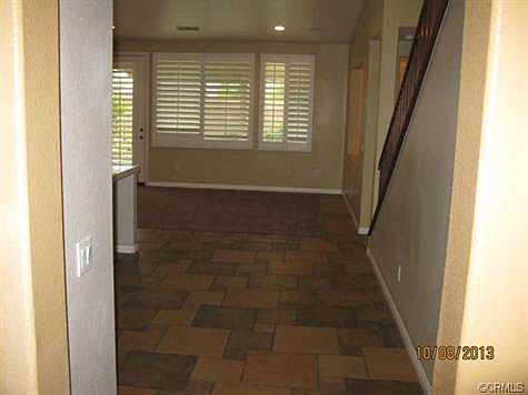 Custom tile, new carpet. View to family room and backyard. Plant