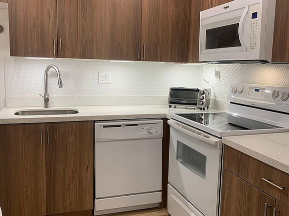 Fully equipped kitchen with pots and pans, and everything you need to enjoy a home cooked meal.