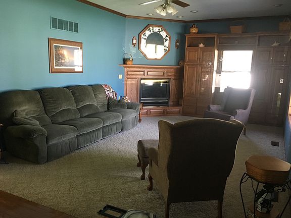 Living room has fireplace