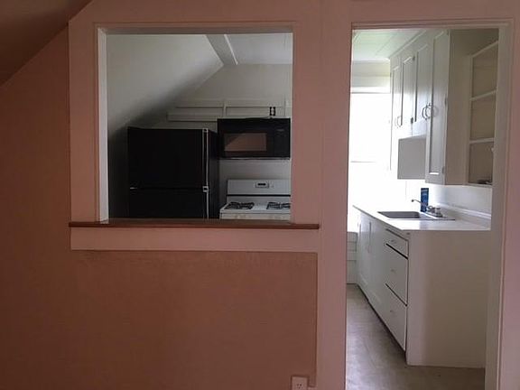 Kitchen with pass through window.