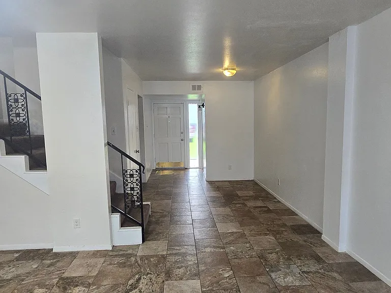 Kitchen is off to the left, half bath on the right