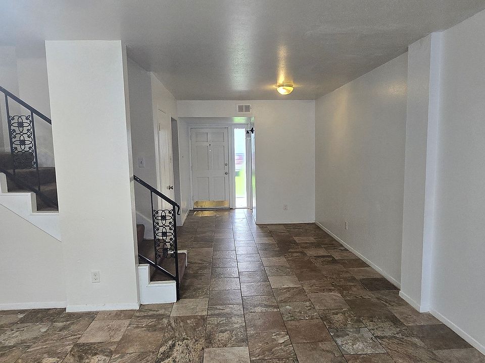 Kitchen is off to the left, half bath on the right