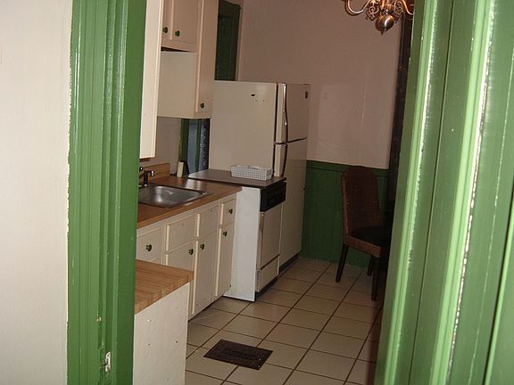 from bathroom doorway into kitchen