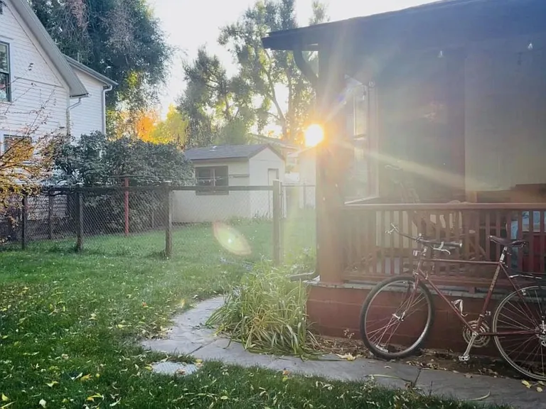 Front porch and side yard at sunset
