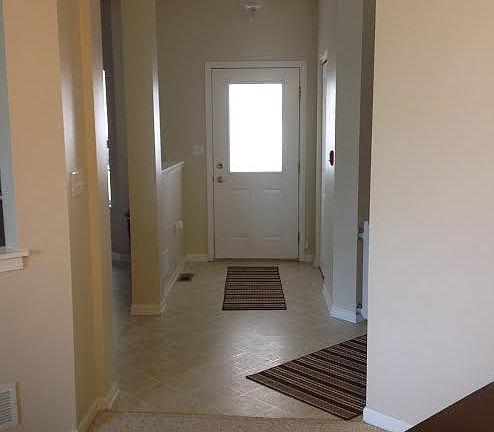  front door, garage to right
