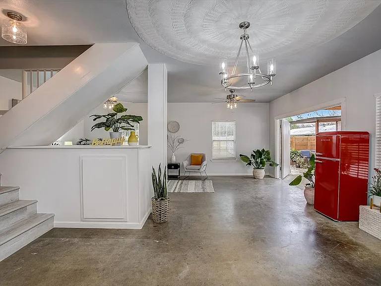 Updated fixtures and easy to maintain concrete floors. *Fridge is white now