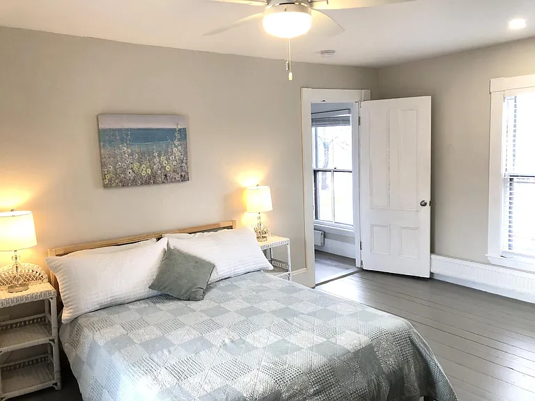 Furnished upstairs bedroom.