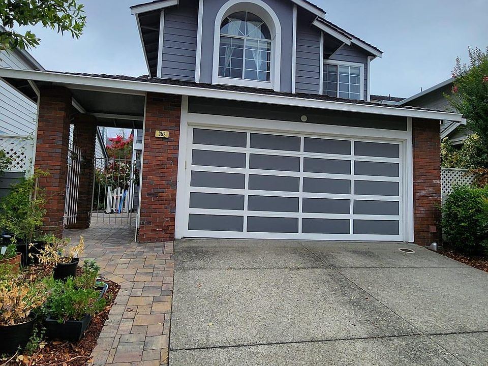 House Front-2 car garage, 2 car drive way & designated guest parking