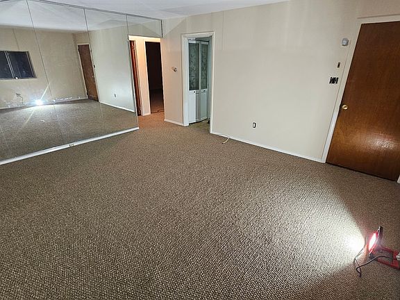 Living Room from far corner. Kitchen doorway middle of picture