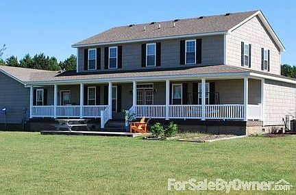 Back of 129 Stable Lane : The home also has a large back porch that leads to a spacious deck.