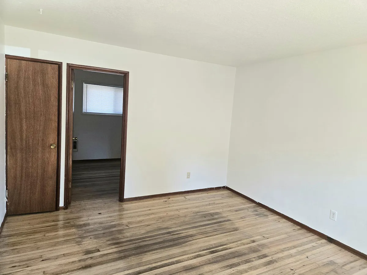 Living area, closet and door leading to the bedroom. - 406 NE 52nd Ave #406