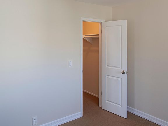 Second bedroom is about the same size as the other one with a walk-in closet. A queen bed with dresser fits nicely.