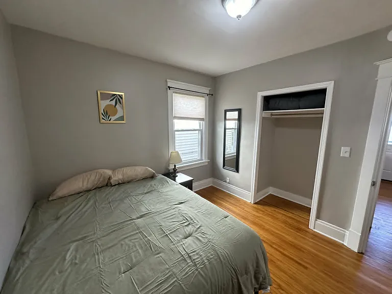 Second bedroom featuring a spacious closet and additional natural light.