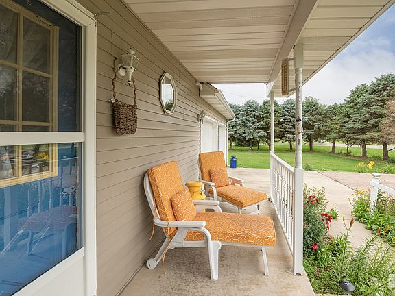 Picturesque front porch perfect for afternoon tea!