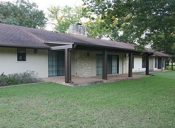 Sliding glass doors lead to large covered patios off the breakfast room, living room and master bedroom.