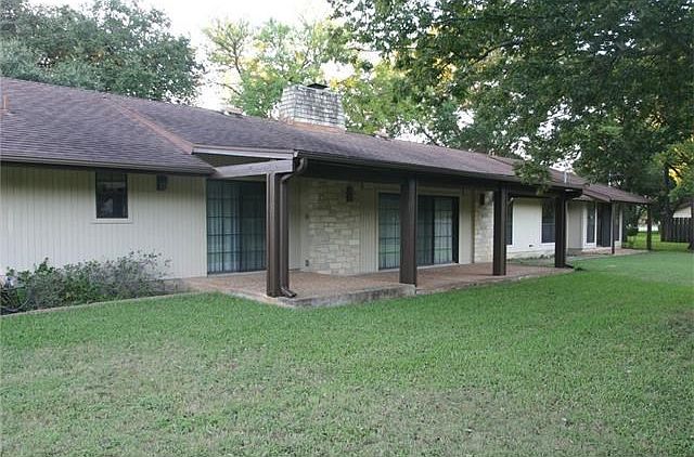 Sliding glass doors lead to large covered patios off the breakfast room, living room and master bedroom.