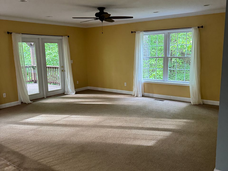 Windows with curtains. Keep them or furnish with your own.