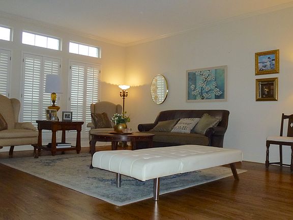 Living room w/ wood blinds