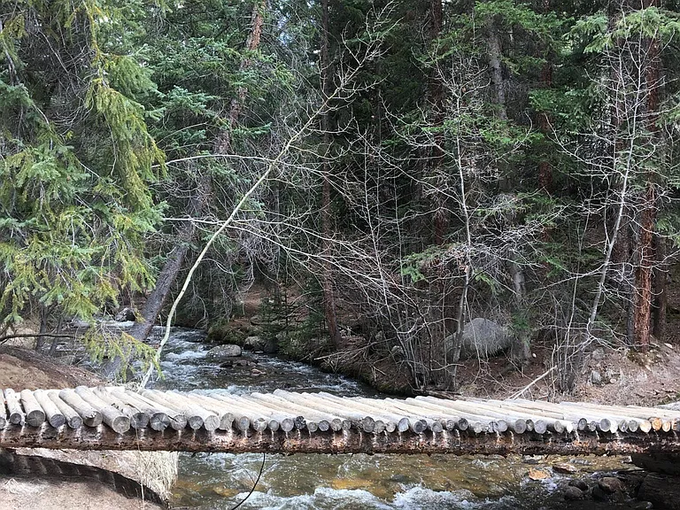 This is a little bridge you can reach by walking into the national forest for about 5 minutes. It's crossing Straight Creek. The trail continues on up heading east.