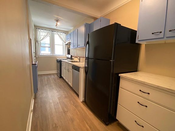 Dishwasher, stove and hood, sink and counters. Ice maker in full size fridge. Slow close drawers and tile back splash.