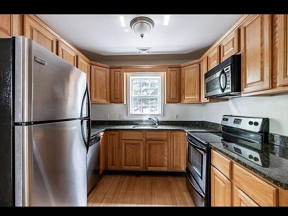 Sunny kitchen. Lots of storage. Fridge has been updated since picture.