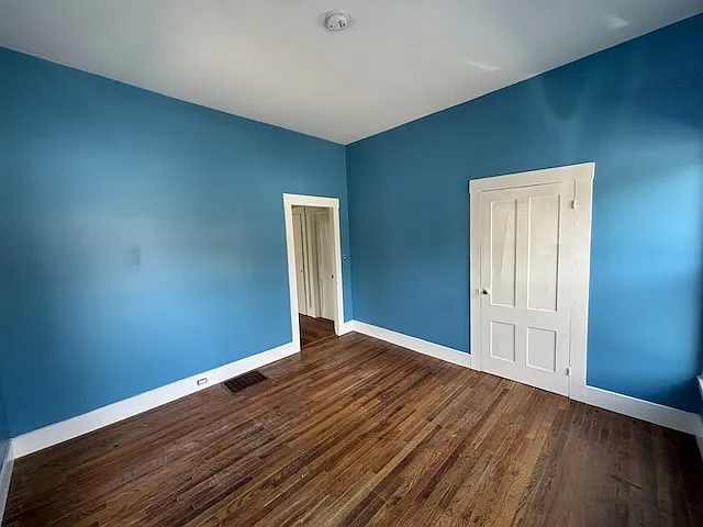 Bedroom with closet door on right
