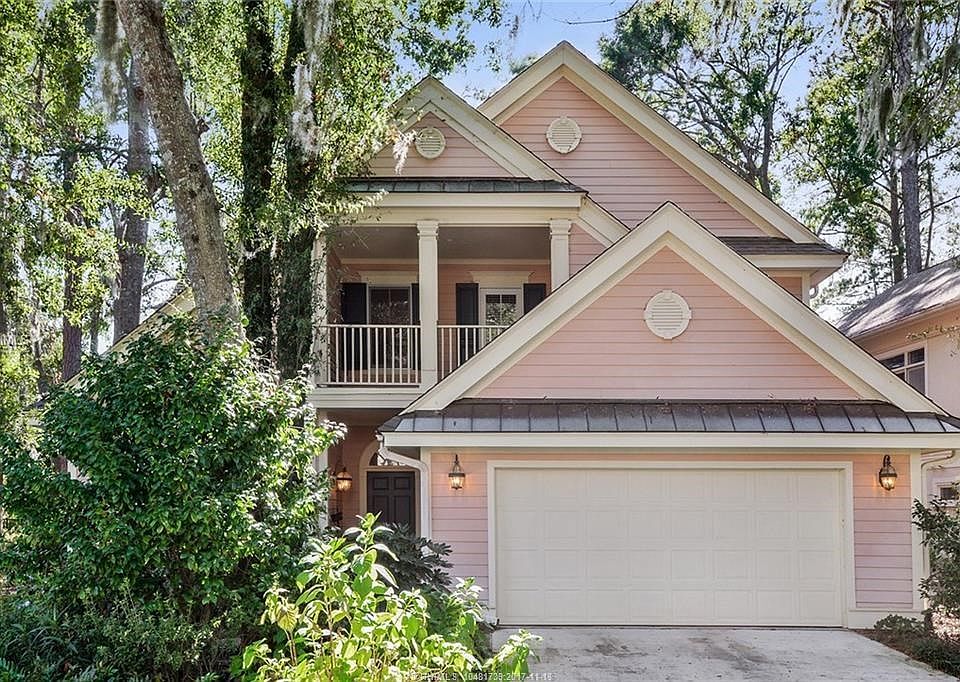 Front elevation with tropical low maintenance landscaping.