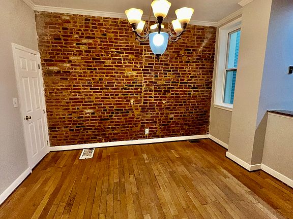 Generous sized dining room, perfect for gatherings and entertaining.