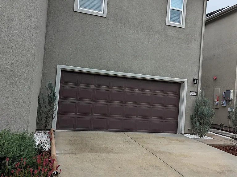 Driveway with attached service walkway.