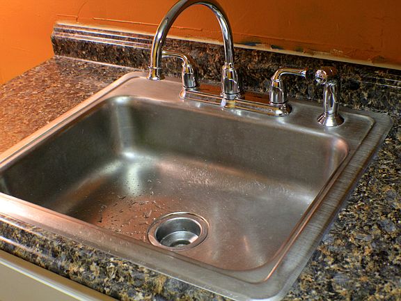 new kitchen, flooring, counter, paint, stove and frig.