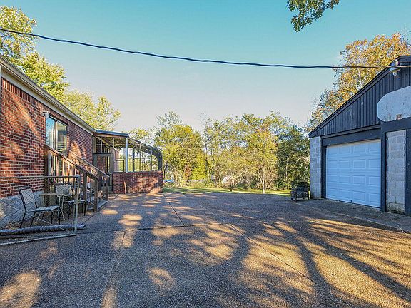south face, sun room, garage, looking East