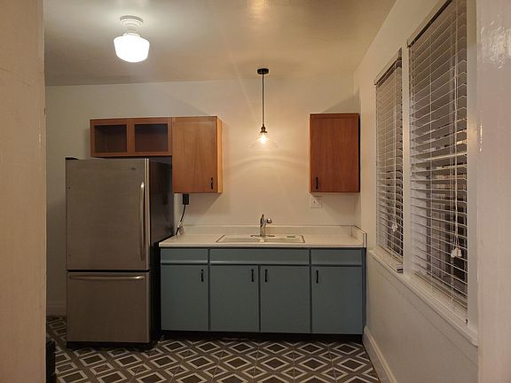 Roomy kitchen with stainless appliances.